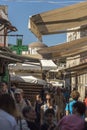 Sunshades, shops and alley Old Town Rhodes. Royalty Free Stock Photo